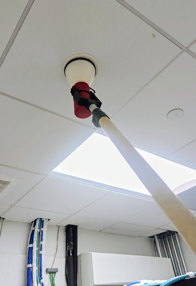 Asgard Smoke Tool AST pole-mounted fire alarm smoke detector tester in use